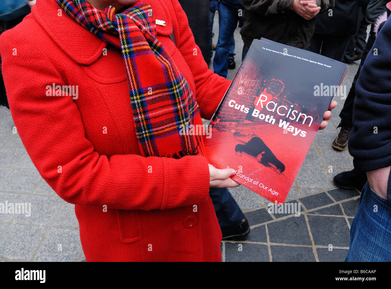 British National Party member handing out their 'Racism Cuts Both Ways'' newspaper in Liverpool 29th. November 2008 Stock Photo