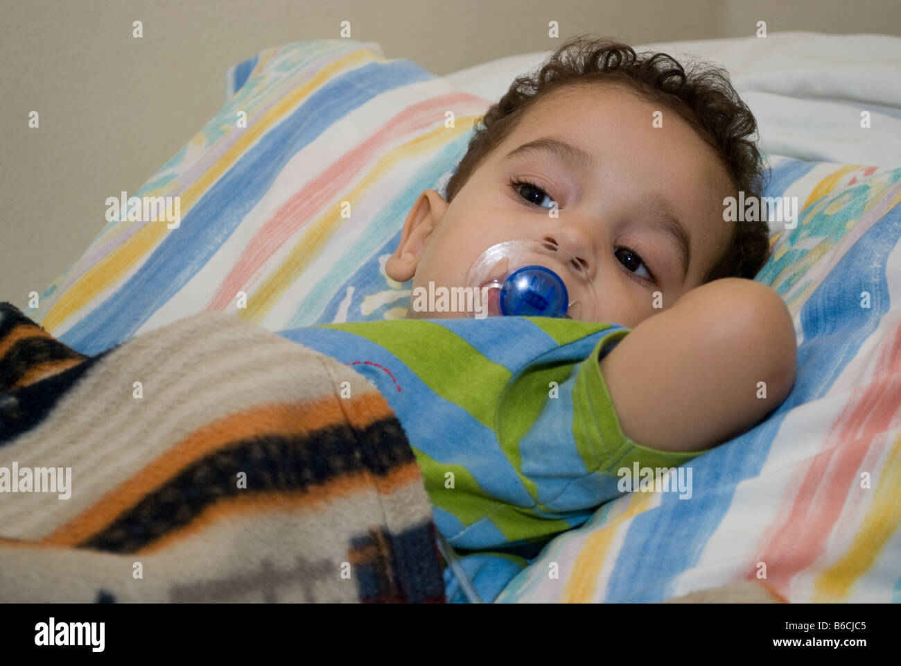 A toddler in bed Stock Photo