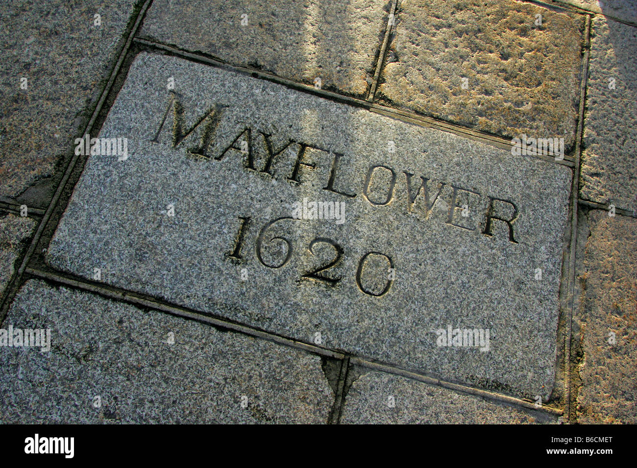Commemorative stone in the pavement at the Mayflower Steps on the Barbican in Plymouth, Devon. Stock Photo