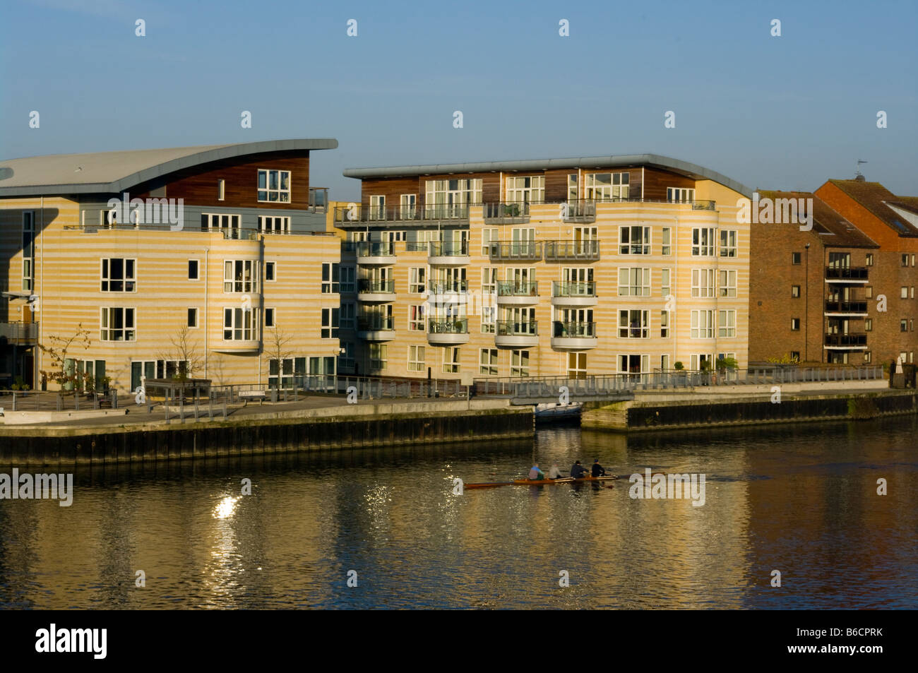The River Thames By modern Riverside waterfront Apartments Hampton Wick Stock Photo