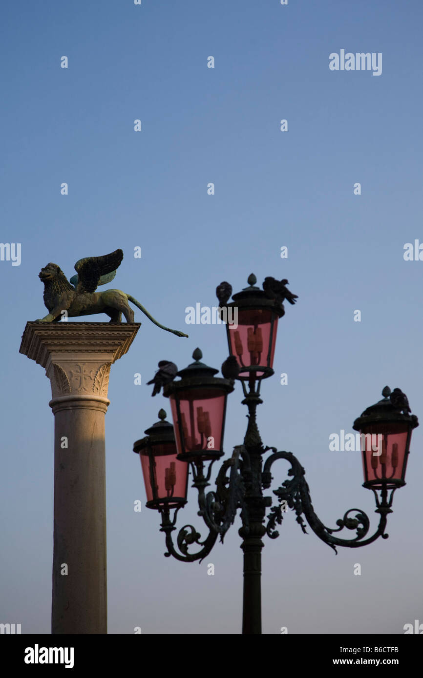Heraldic lion sculpture on column and lamp post against blue sky, Piazza  San Marco, Veneto, Venice, Italy Stock Photo - Alamy, image size:866x1390