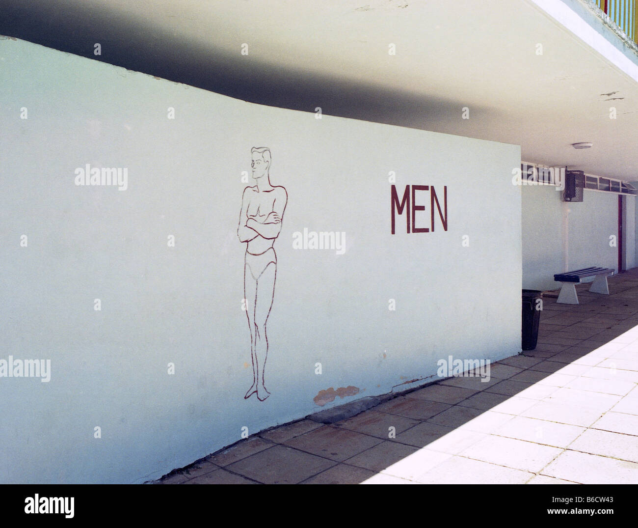 Male figure on wall of changing room at swimming pool, Cape Town, South Africa Stock Photo