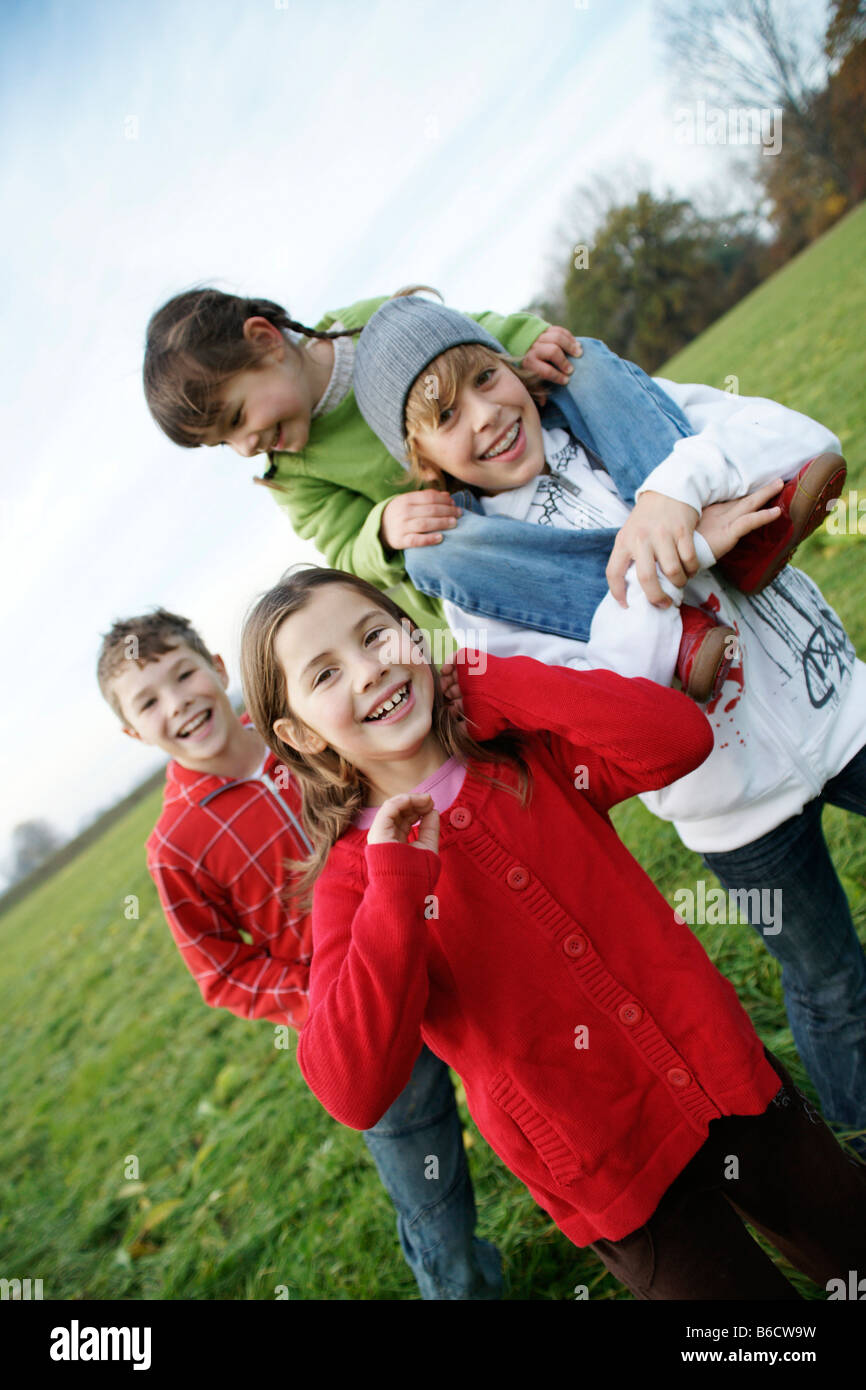 Portrait of two boys and girls smiling Stock Photo - Alamy