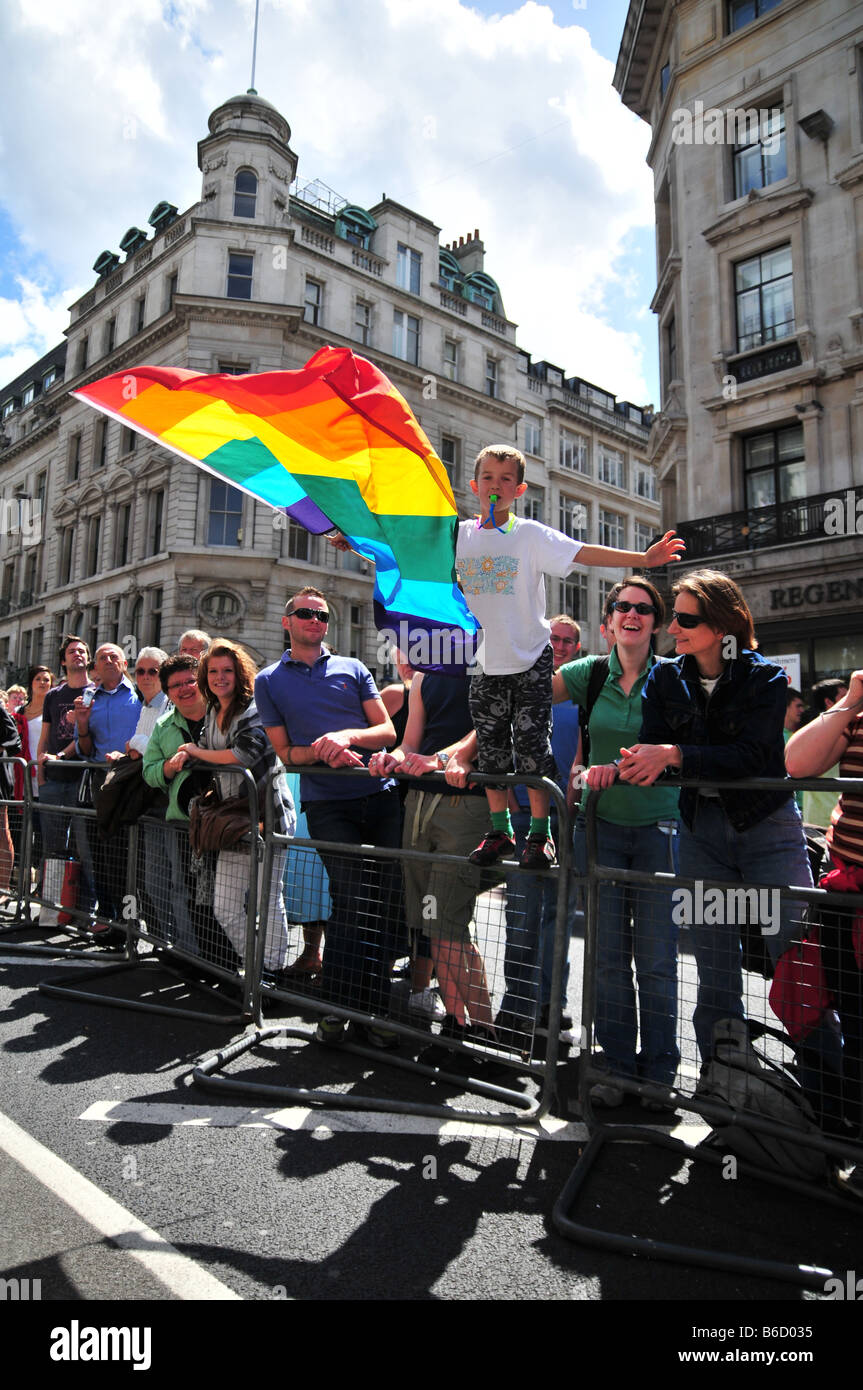 A young boy waves the Gay Pride Rainbow flag Stock Photo