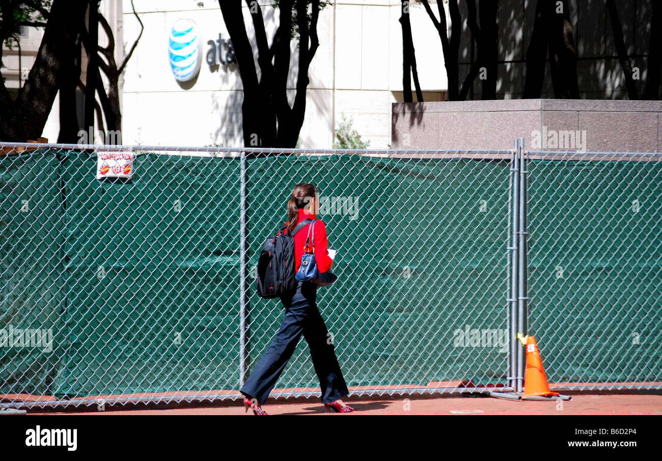 Woman walking in downtown area Stock Photo