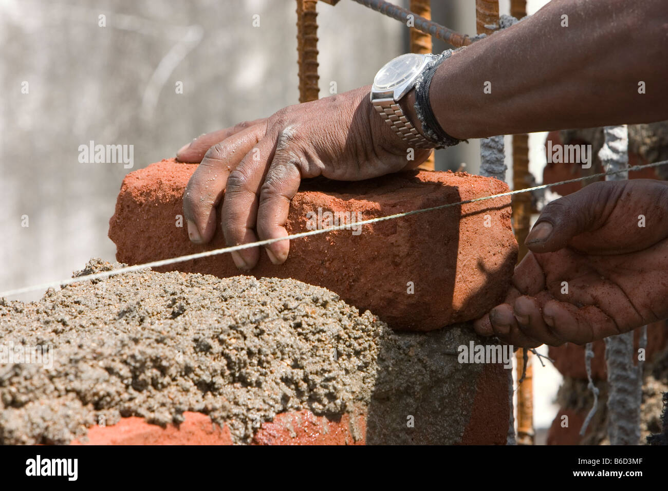 A mason building a brick wall Stock Photo Alamy