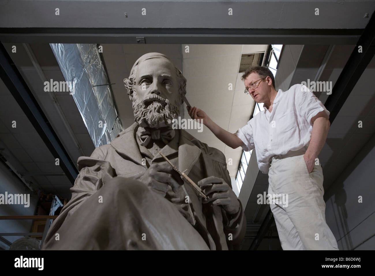 Sculptor Alexander Stoddart working on the clay version of his statue the Scottish scientist,James Clerk Maxwell. Stock Photo