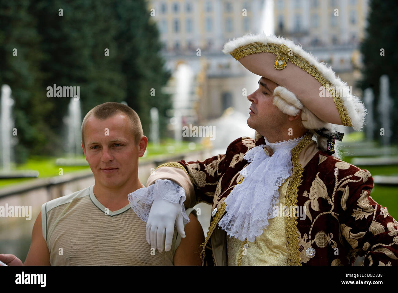 Russia, Saint Petersburg, Peterhof, Parks and castles. Visitor and man in traditional clothing Stock Photo