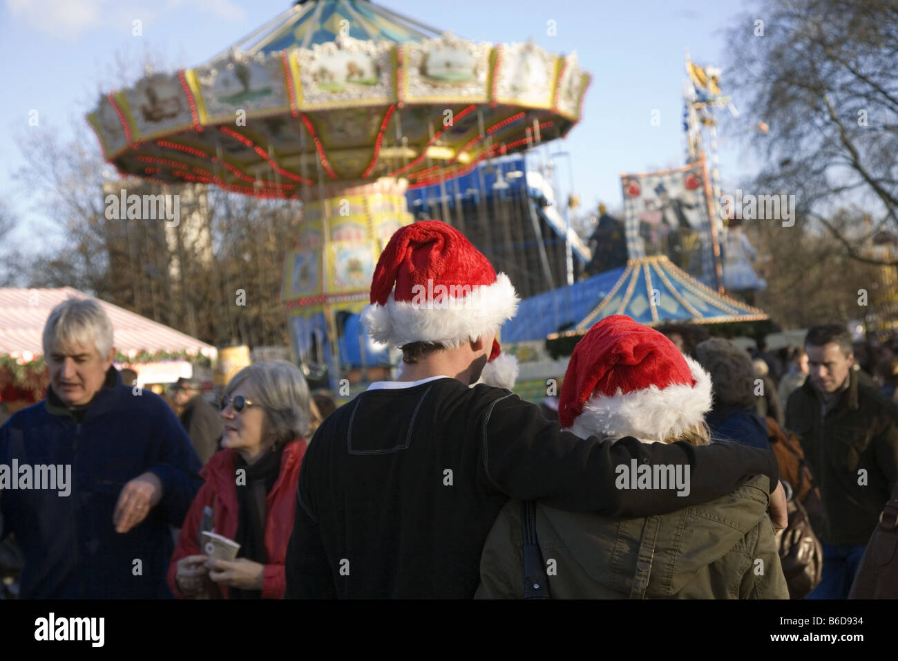 couple with santa hats at winter wonder in hyde park london Stock Photo