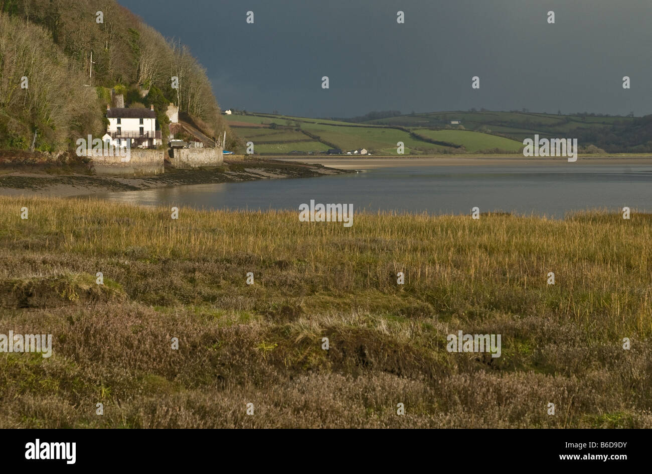 The Boat House at Laugharne Carmarthenshire once lived in by Dylan Thomas across the marshes of the Taf Estuary Stock Photo