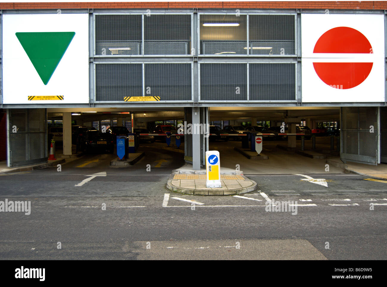 colours and shapes used to indicate entrance and exit on a car park