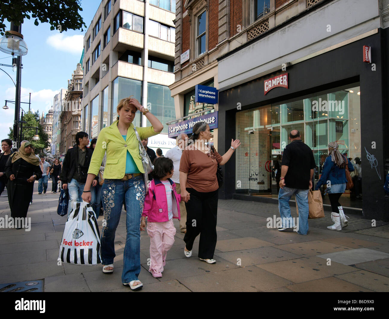 People shopping on Oxford Street London UK Stock Photo