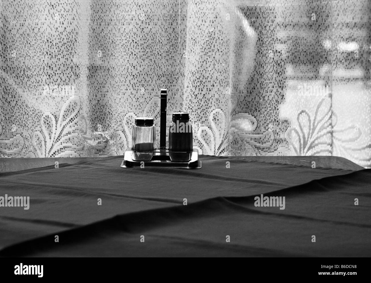 Salt and pepper in curtained Budapest cafe Stock Photo