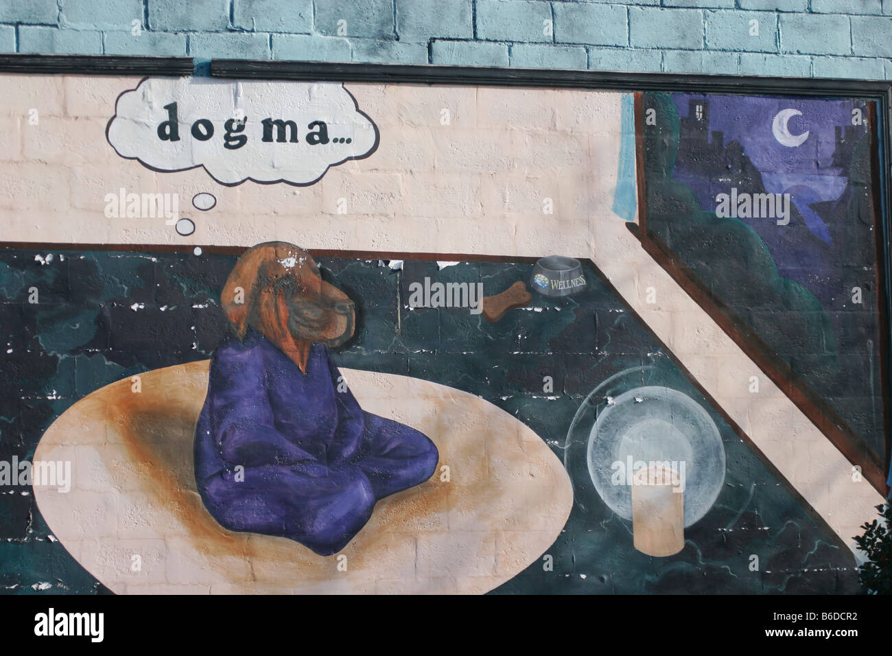 Funny mural painting on downtown building of a contemplative dog Stock Photo
