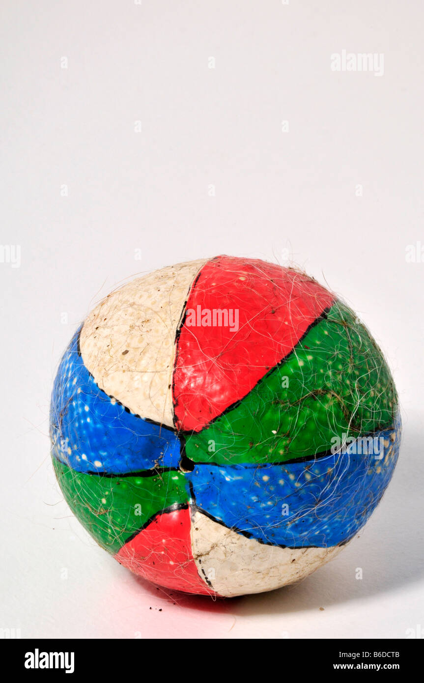 dogs old chewed ball hairy colours round loved play fun chase run  fit  exsert exercise energy balls bounce tired red blue green Stock Photo