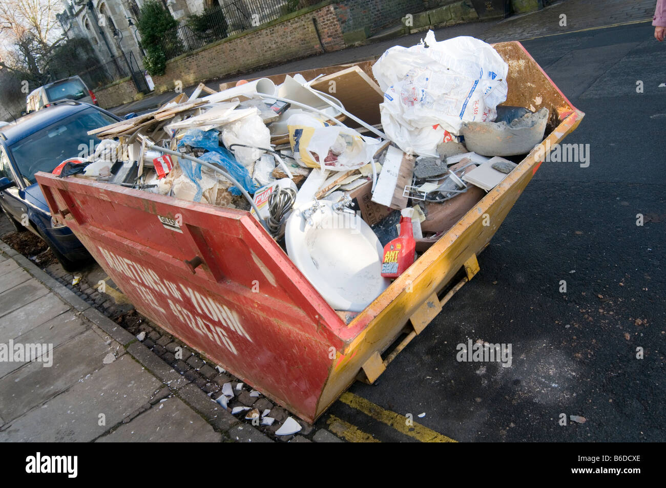 skip trash rubbish junk scrap throwaway dumpster can waste dispose disposal dump refuse disposal bin landfill uk tax Stock Photo