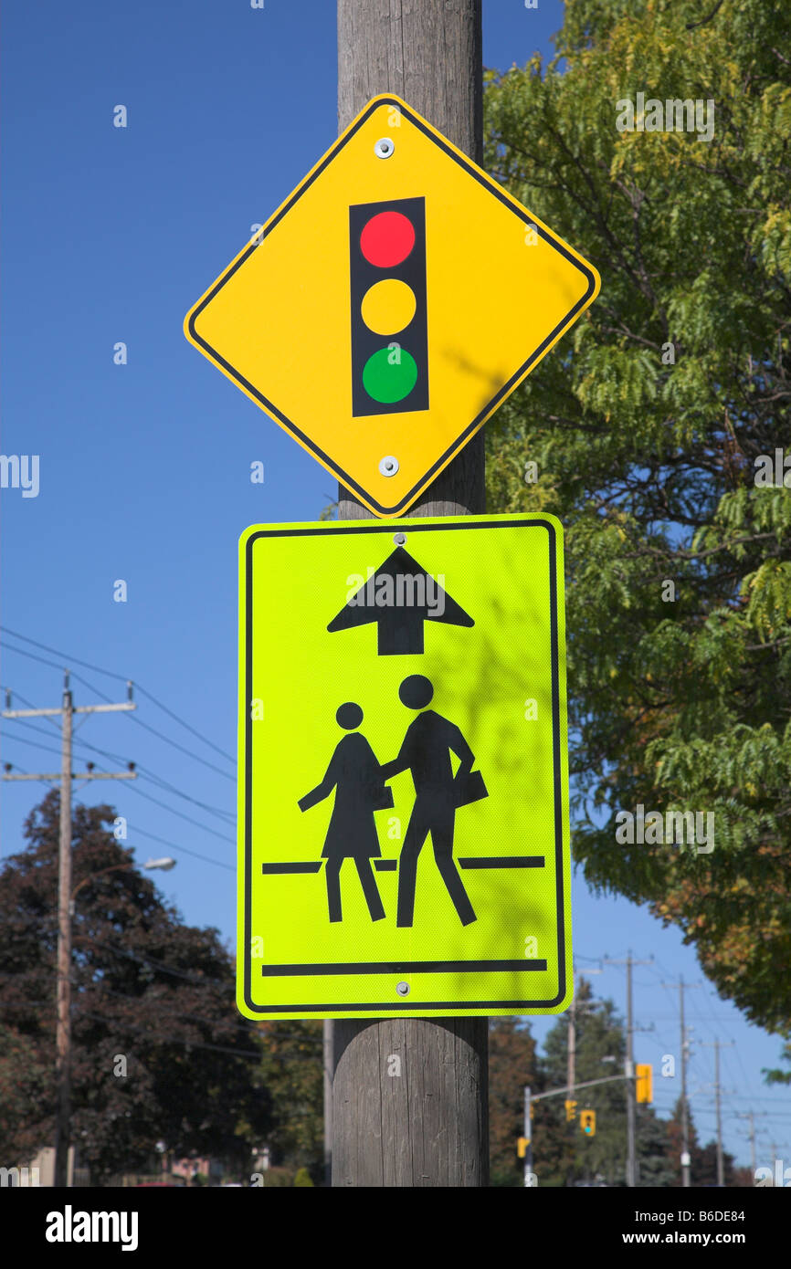 Traffic lights and school crossing road signs in Canada. Stock Photo
