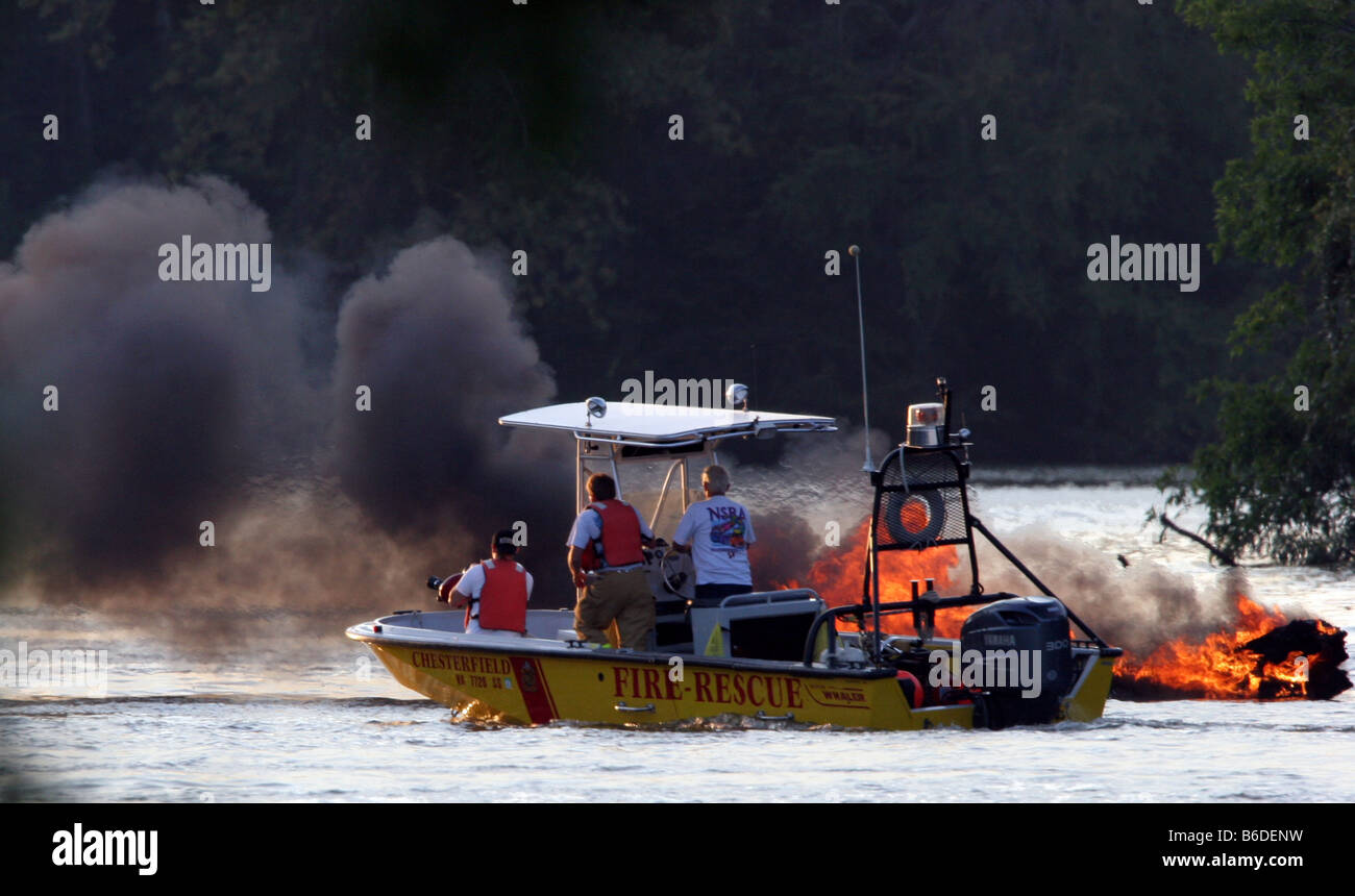 Chesterfield,  Virginia. Fire and emergency services personnel respond to a boat fire on the James river, all 3 people rescued. Stock Photo