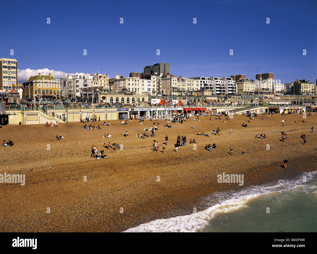 People on Brighton Beach in Sussex, England Stock Photo
