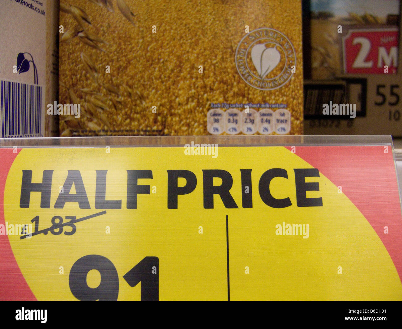 HALF PRICE sign in a supermarket store Stock Photo