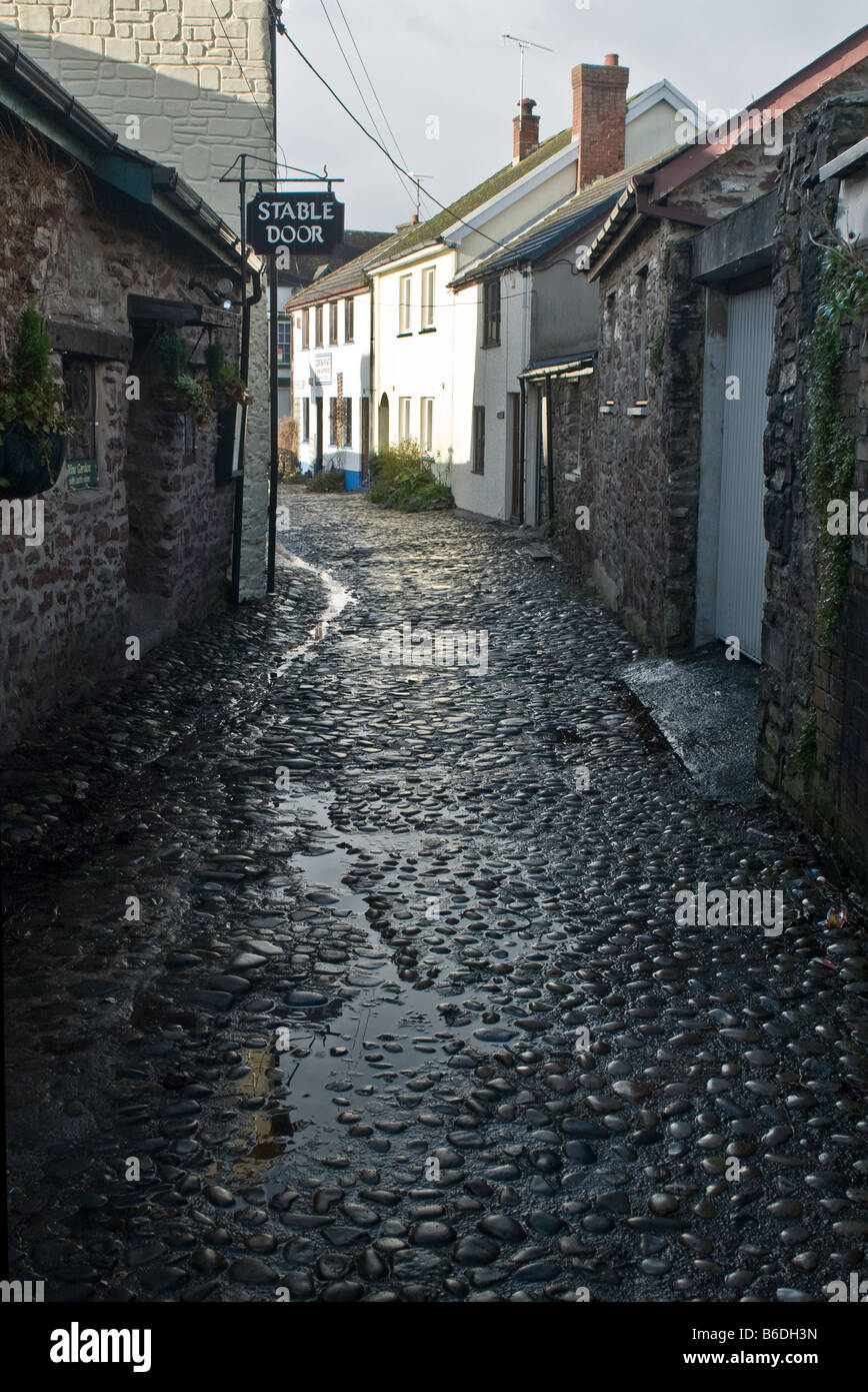 Cobbled back street in Laugharne Carmarthenshire after a heavy rain shower Stock Photo