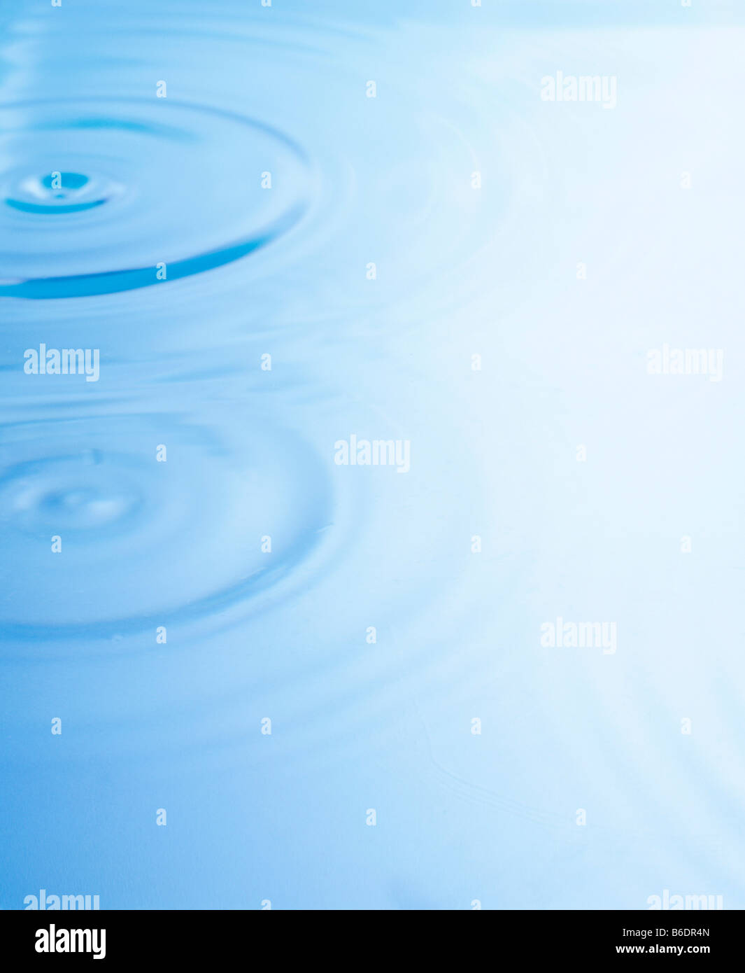 Ripples on the surface of watermoving out in circular waves Stock Photo