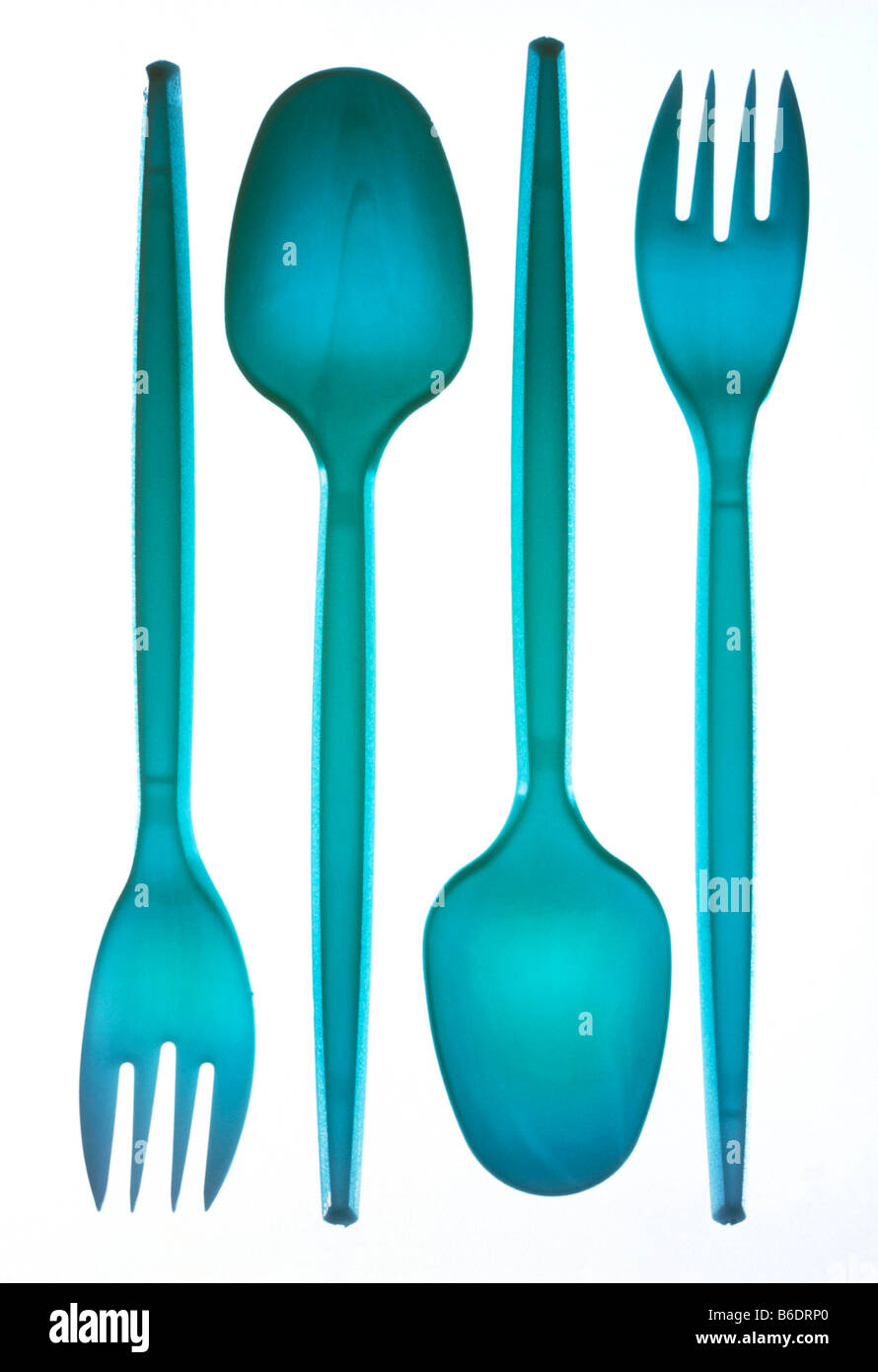 Plastic cutlery. Spoons and forks made of plastic. Stock Photo