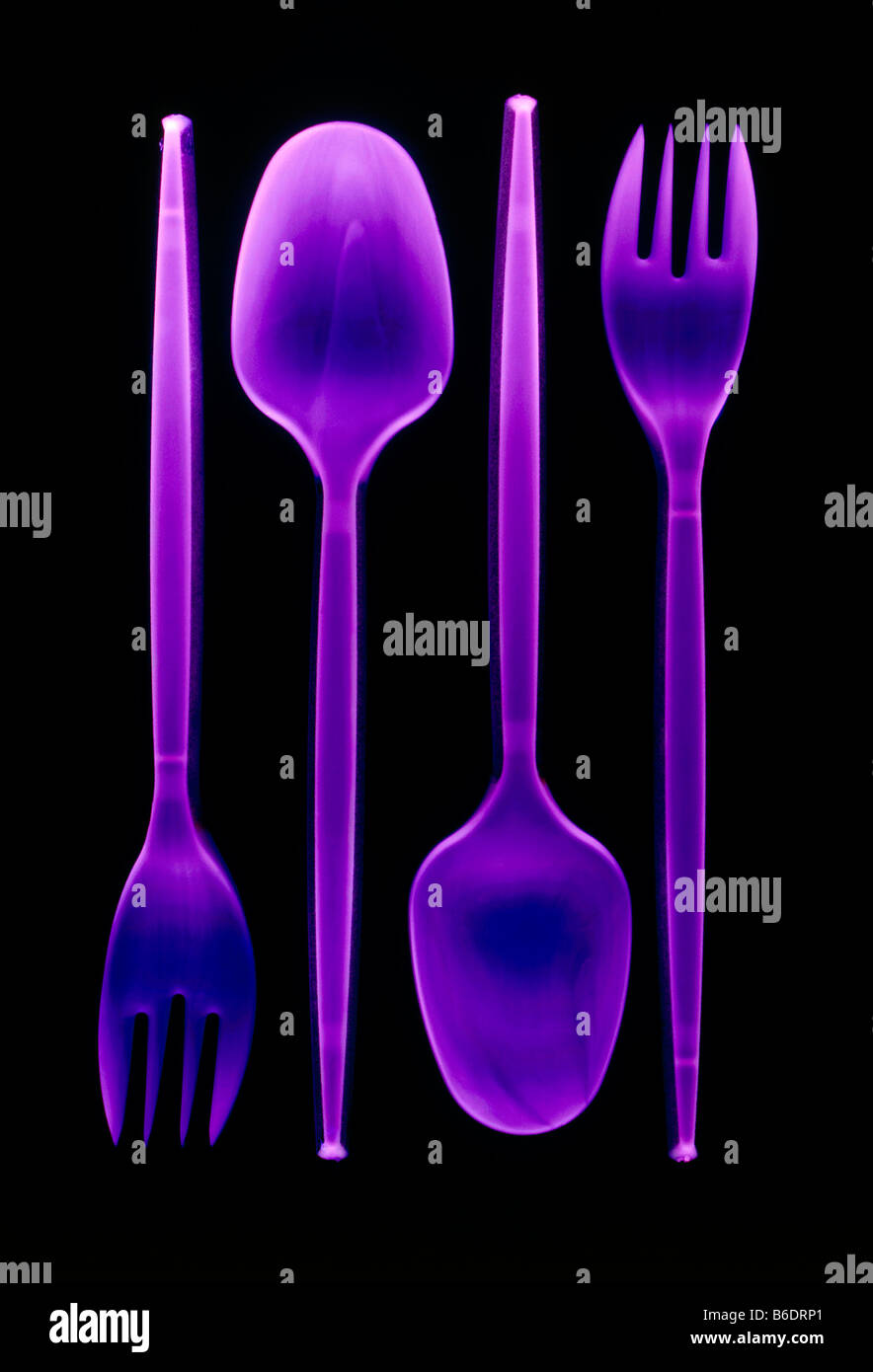 Plastic cutlery. Spoons and forks made of plastic. Stock Photo