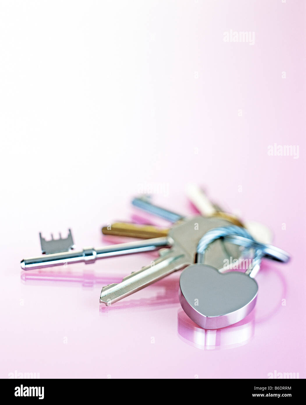 Keys. Set of keys on a heart-shaped pendant keyring. Stock Photo