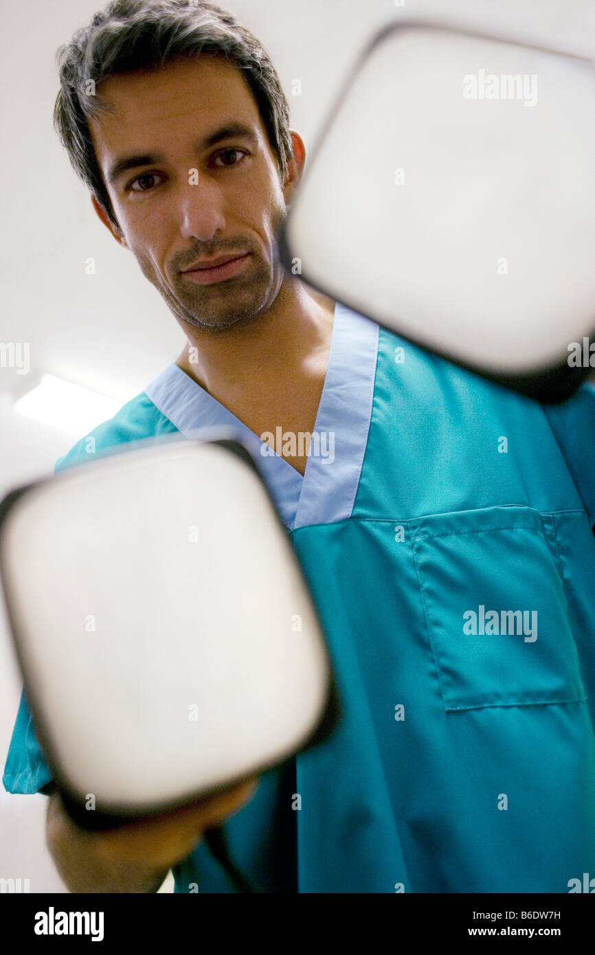 Emergency defibrillation. Doctor holding defibrillation electrode