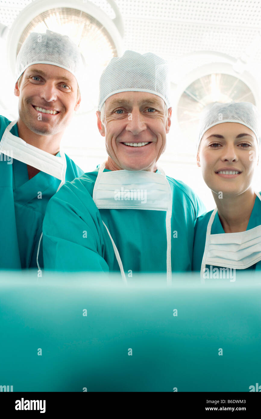 Surgical team in an operating theatre. Stock Photo