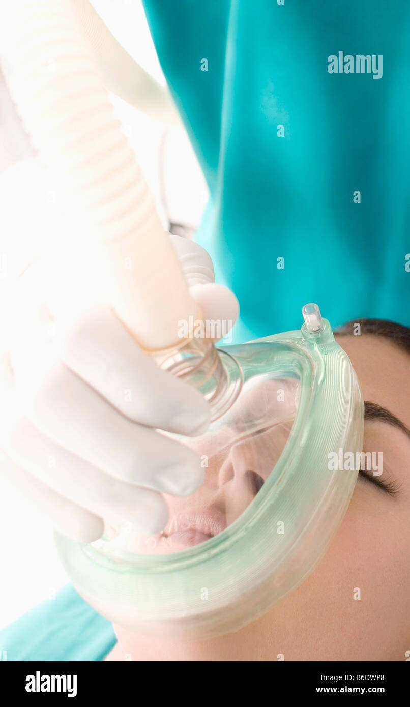 Anaesthesia. Anaesthetist administering gas to a patient. The gas is a general anaesthetic. Stock Photo