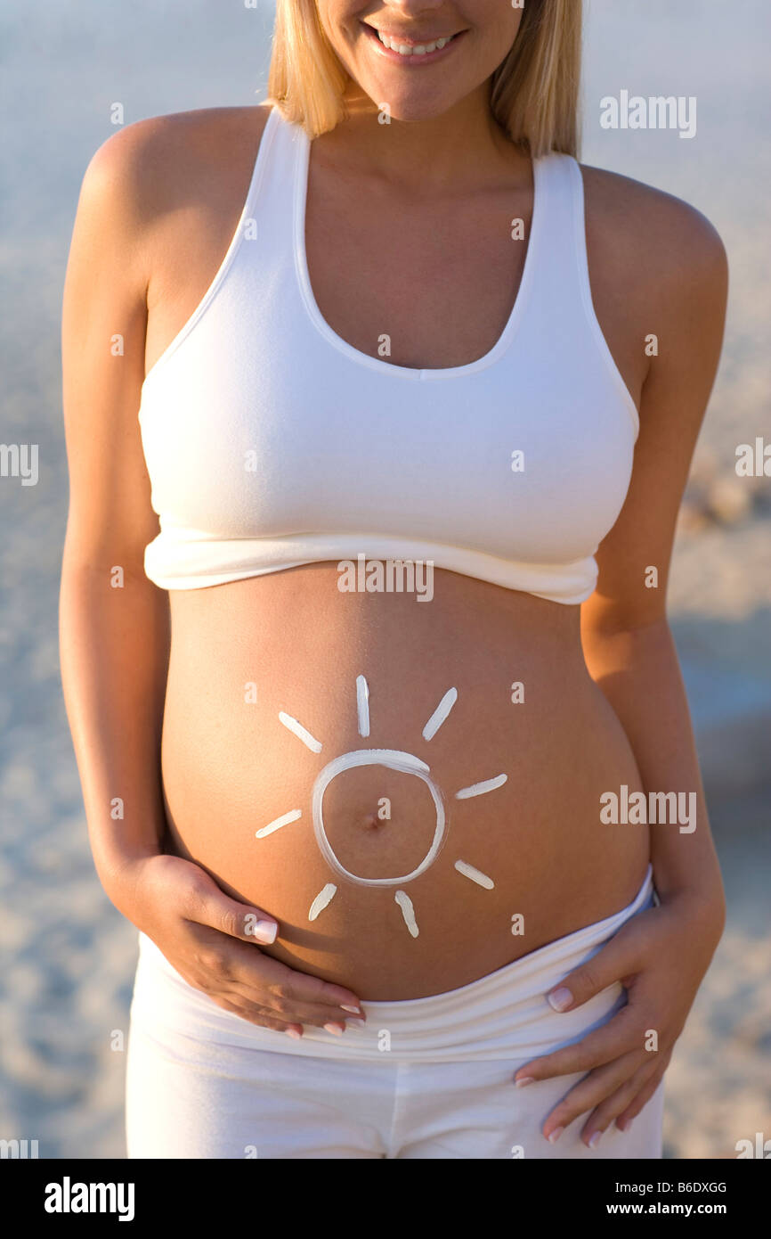 Sun Protection During Pregnancy Sun Shape Drawn In Sun Cream On A Stock Photo Alamy