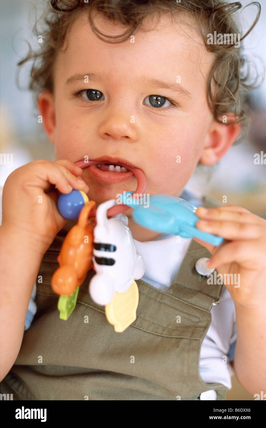 Baby boy. 9-month-old baby boy with a toy in his mouth Stock Photo - Alamy