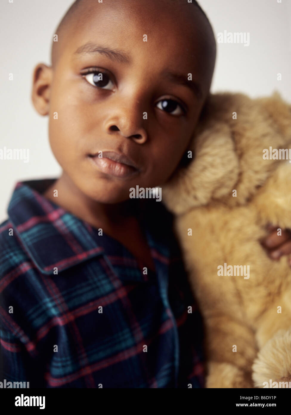 Boy with teddy bear.4 year old boy smiling and holding a teddy bear ...