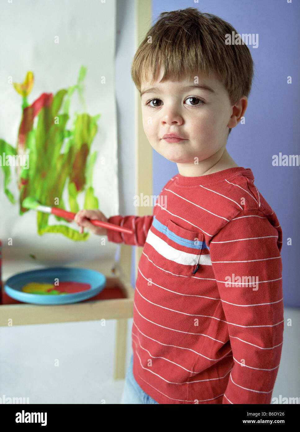 Boy painting. He is three years old Stock Photo Alamy