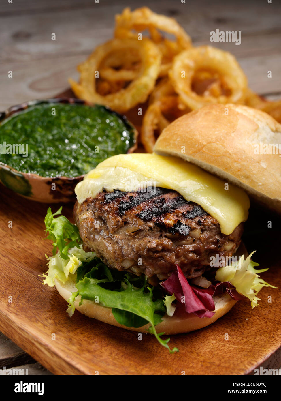 Cheeseburger and green chilli and coriander relish editorial food Stock