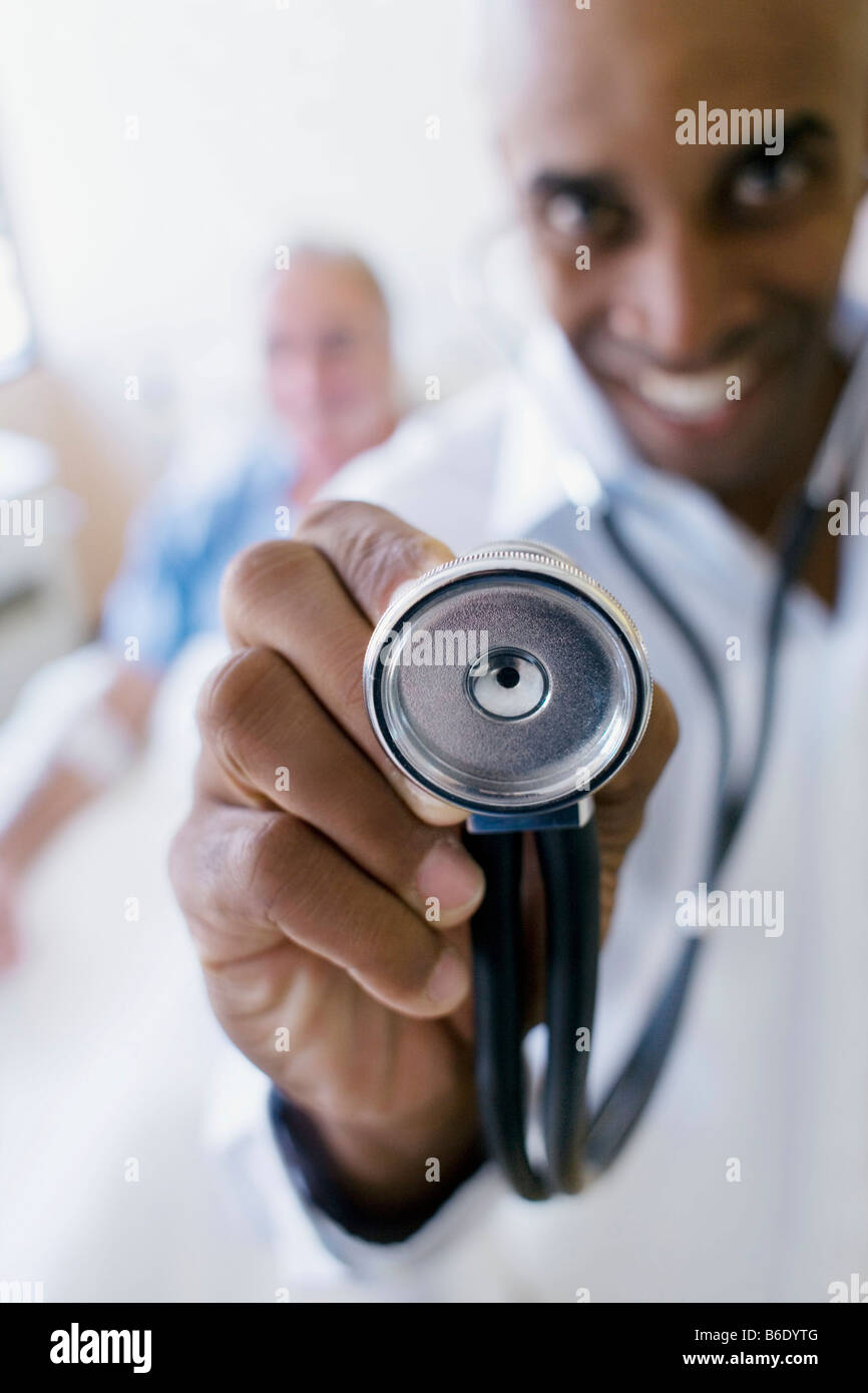 Doctor holding a stethoscope. The stethoscope allows the doctor to ...