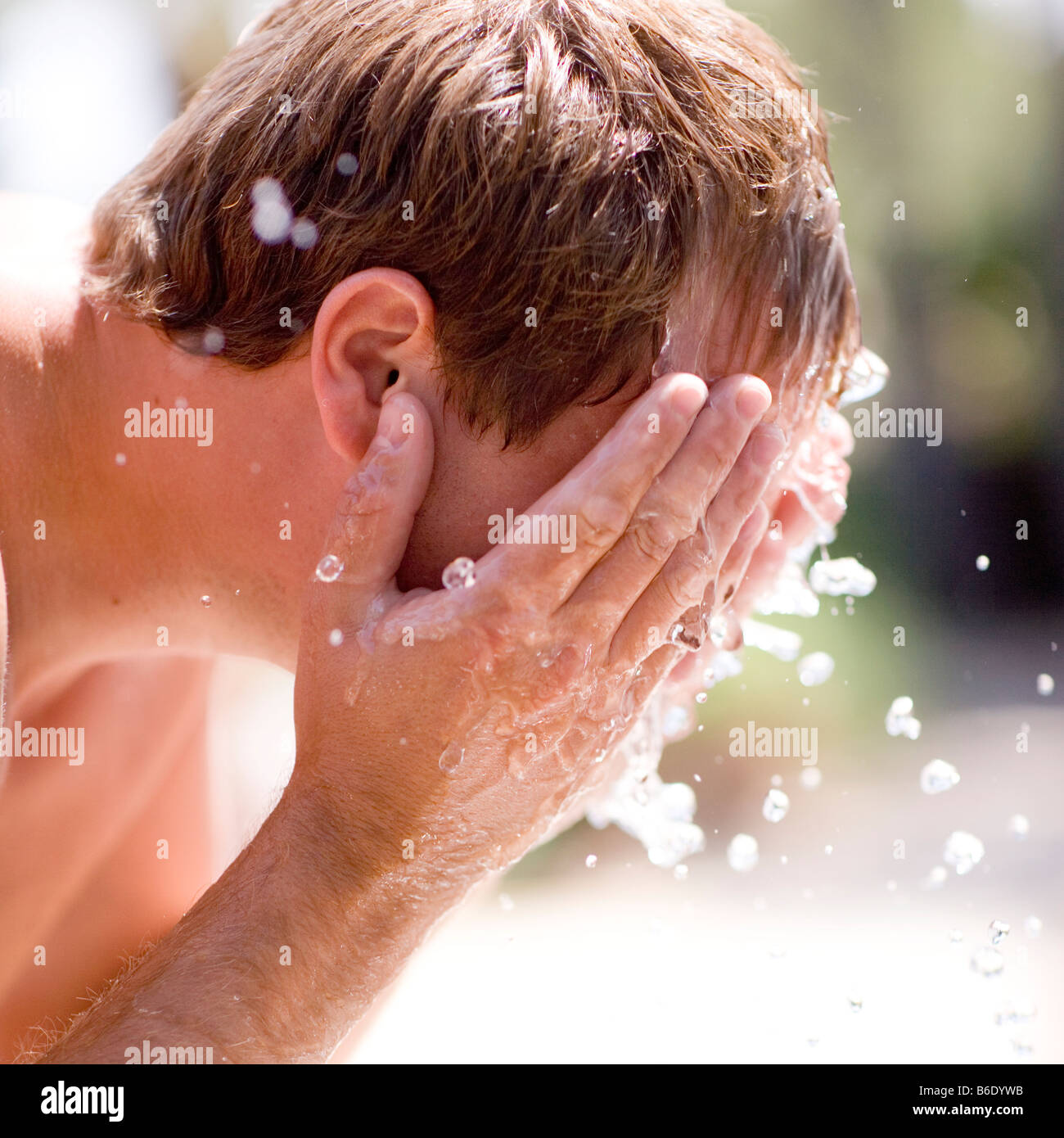 Man washing his face with cold water Stock Photo Alamy
