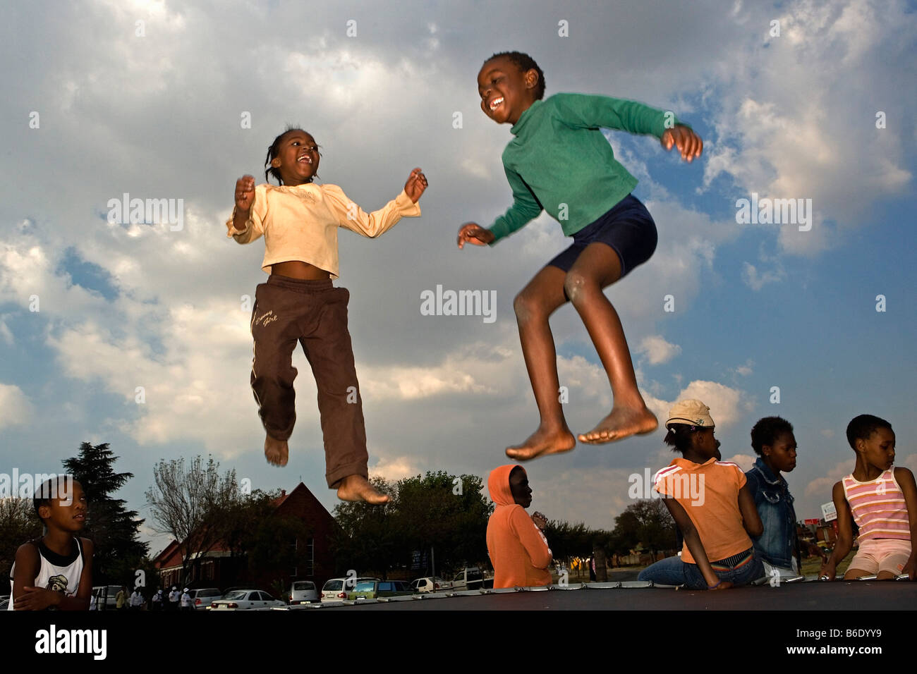 South Africa, Johannesburg, Soweto, Children jumping on trampoline
