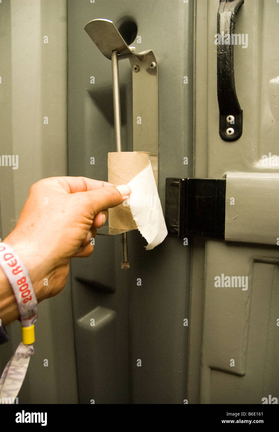 down to the last piece of toilet paper in a V festival portable toilet Stock Photo