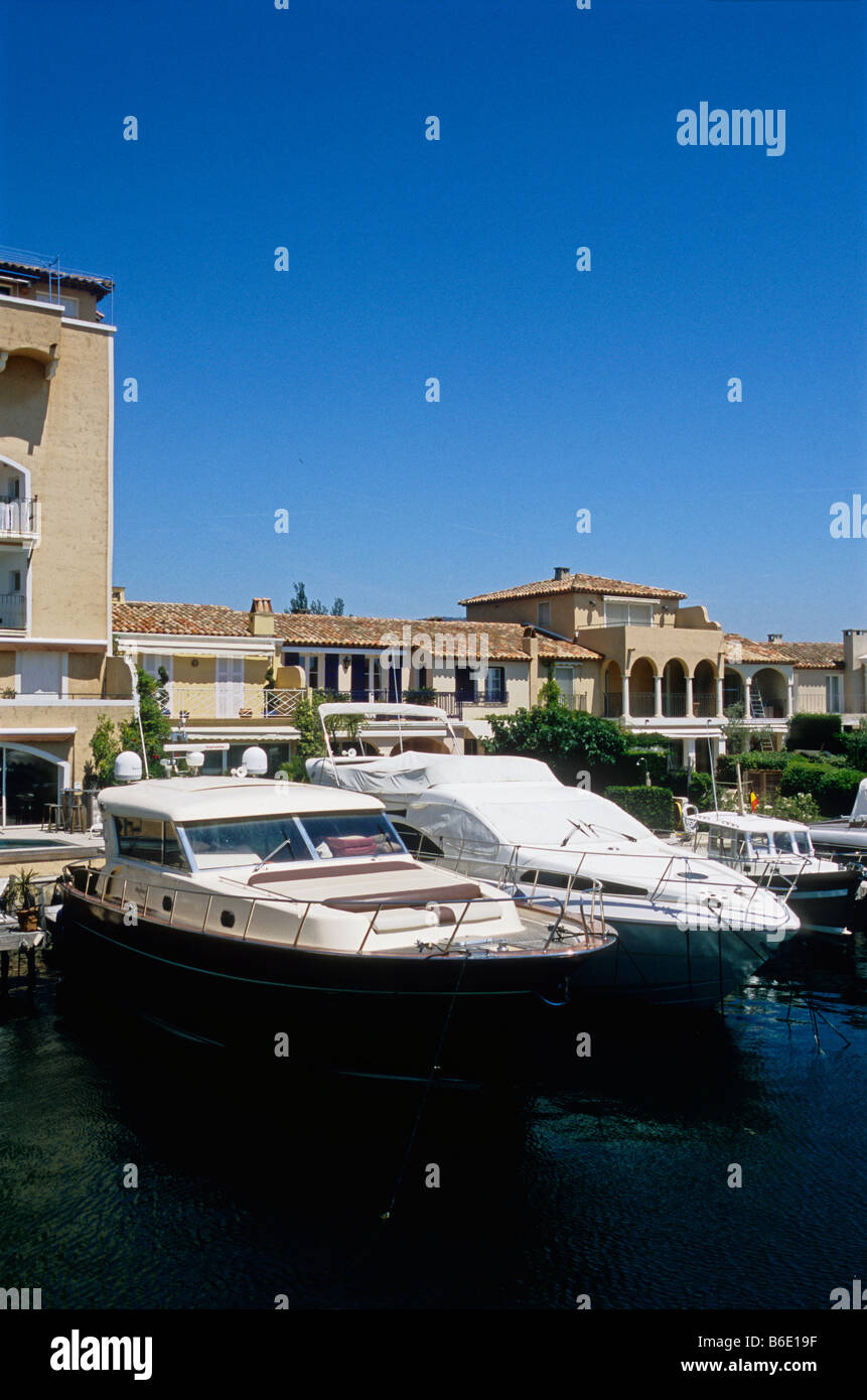 Moored boat and yacht in one of the canal of Port Grimaud village Stock Photo