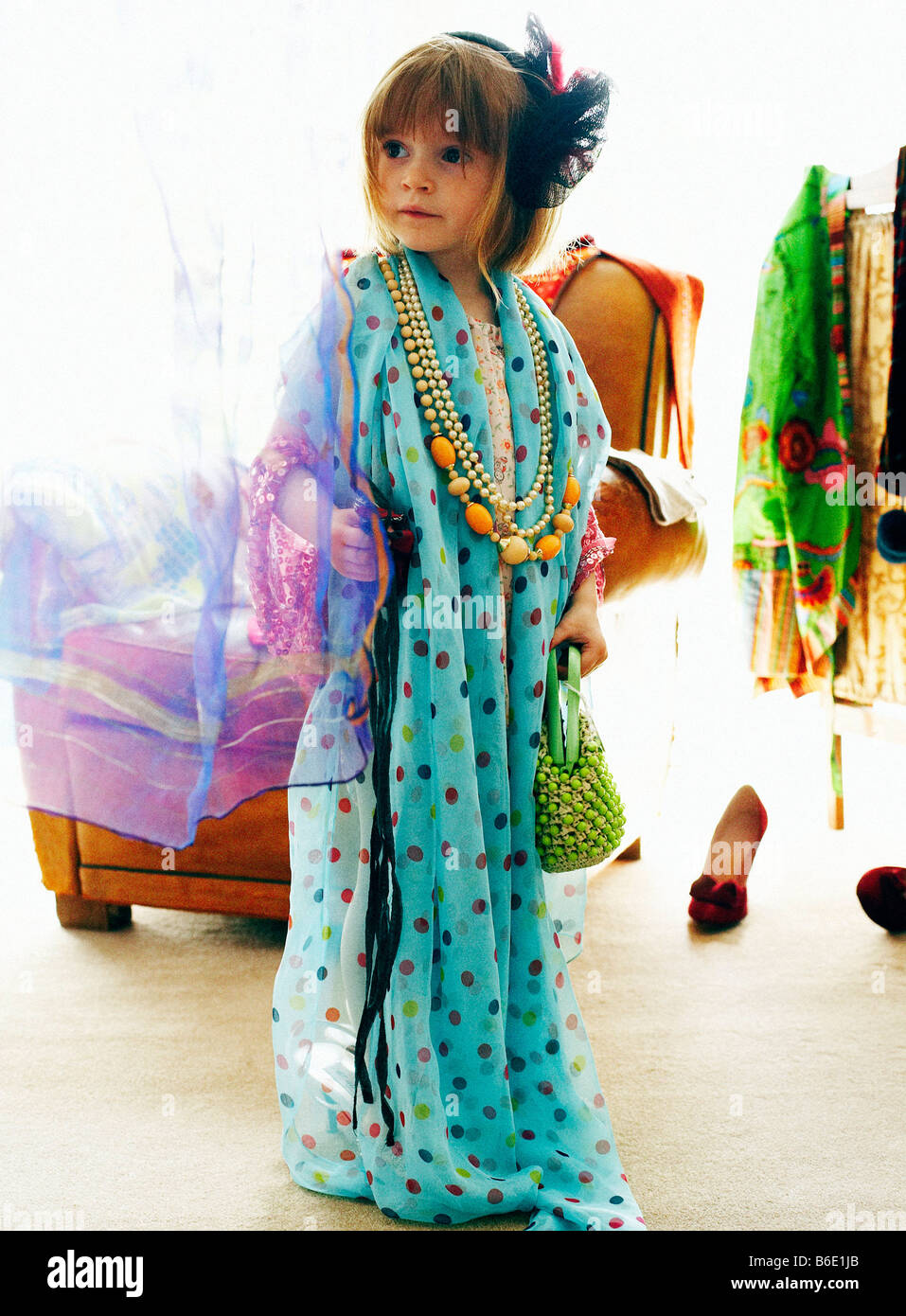 Dressing up. Four year old girl playing dressing up games Stock Photo
