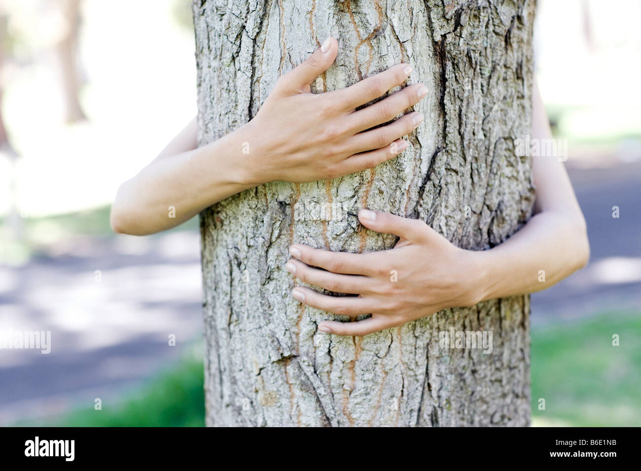 Young woman arms wrapped around hi-res stock photography and images - Alamy