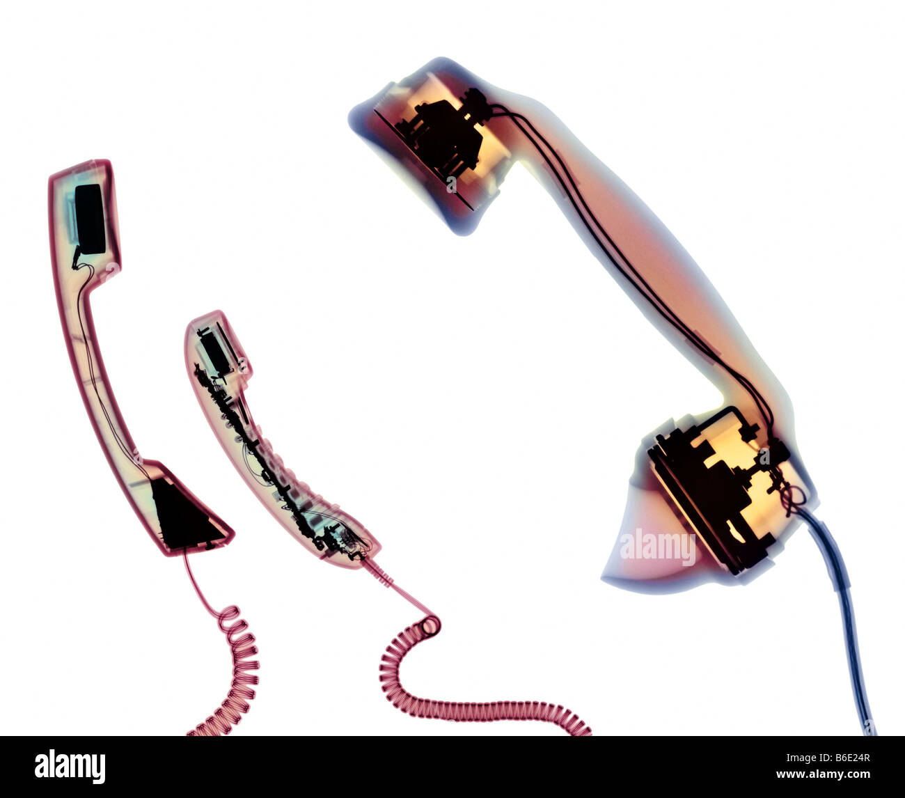 Conceptual coloured X-ray of paired telephone handsets representing communication between partners in loving relationships Stock Photo