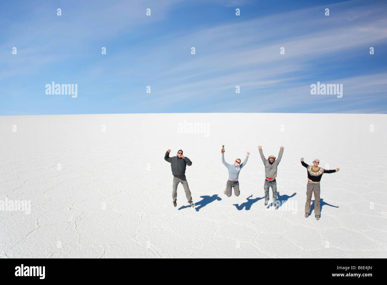 Jumping on the salt flats near Uyuni,Bolivia. Its just what you do! Stock Photo