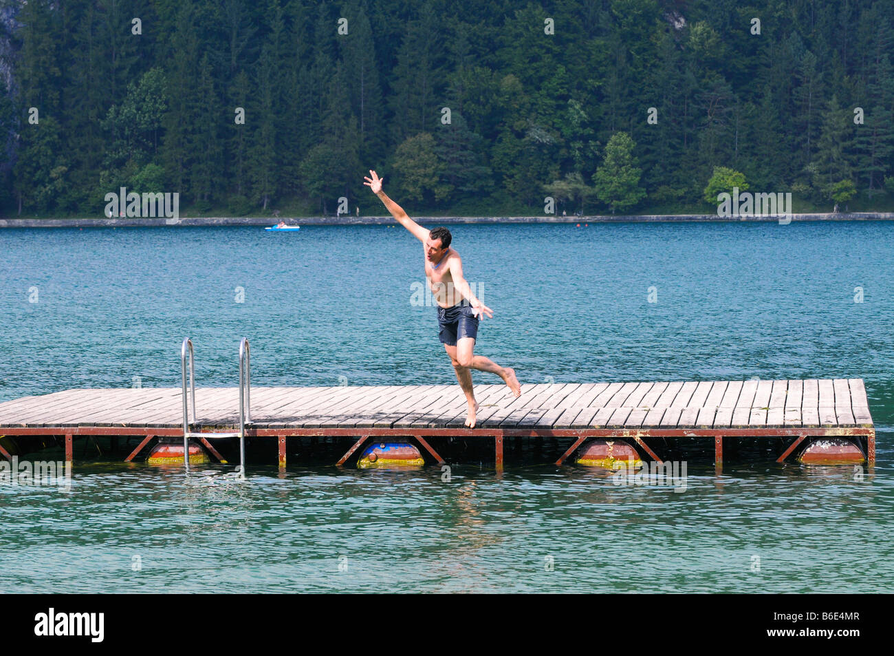 action shot of man falling into lake Stock Photo