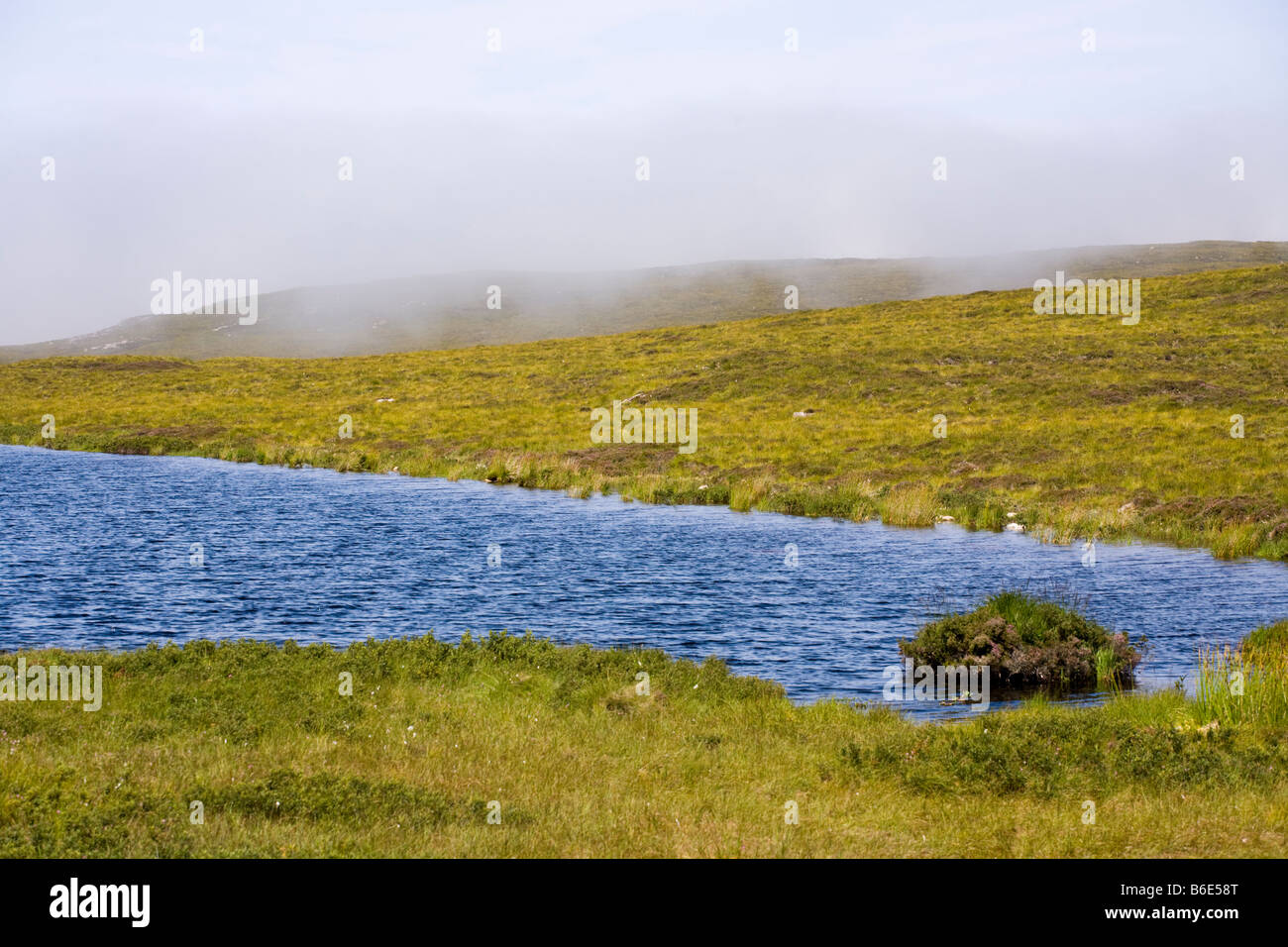 Scotch mist descending on Loch Dubh na Maoil, Mellon Udrigle, Wester Ross, Highland, Scotland Stock Photo
