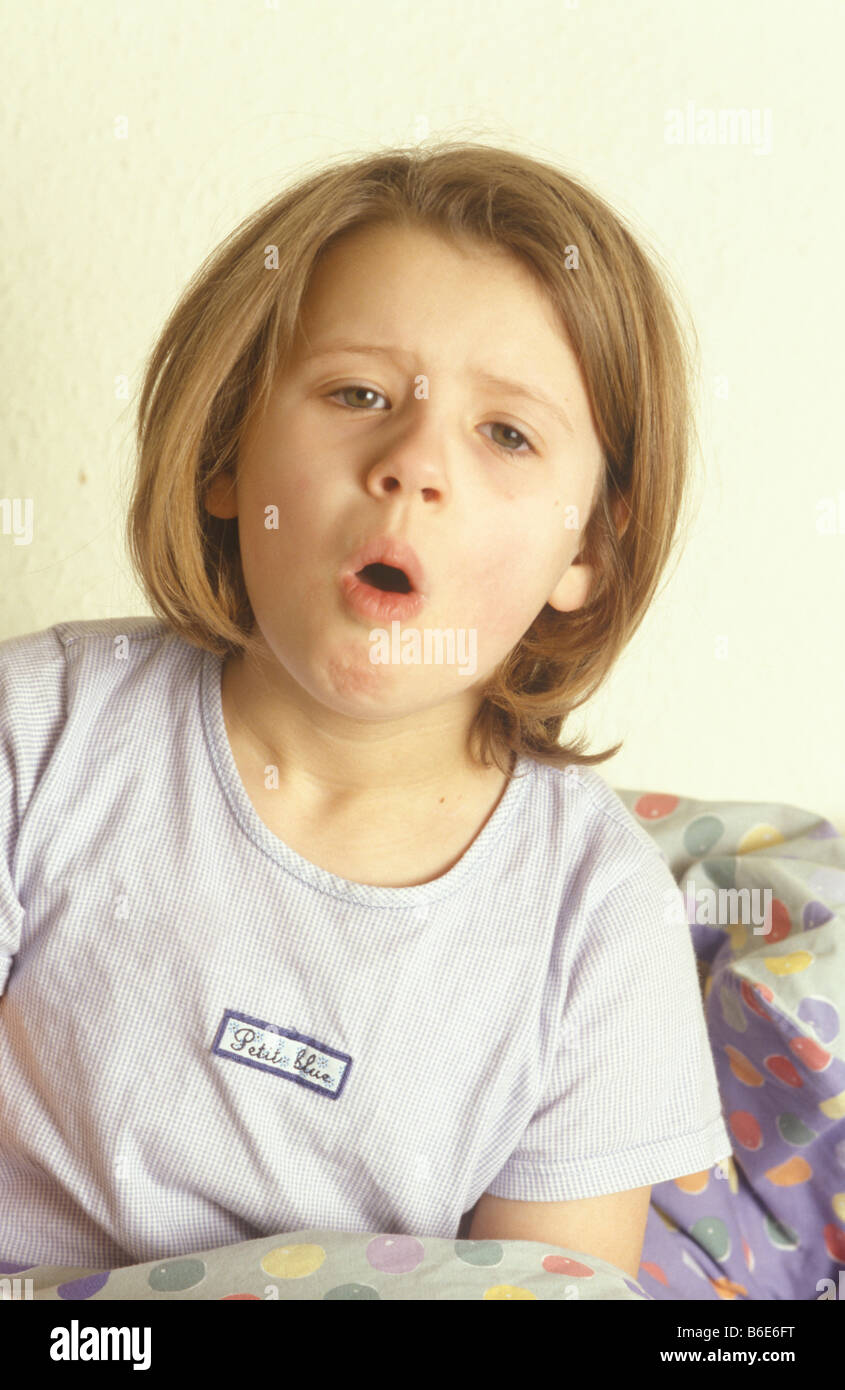 little girl coughing in bed Stock Photo Alamy