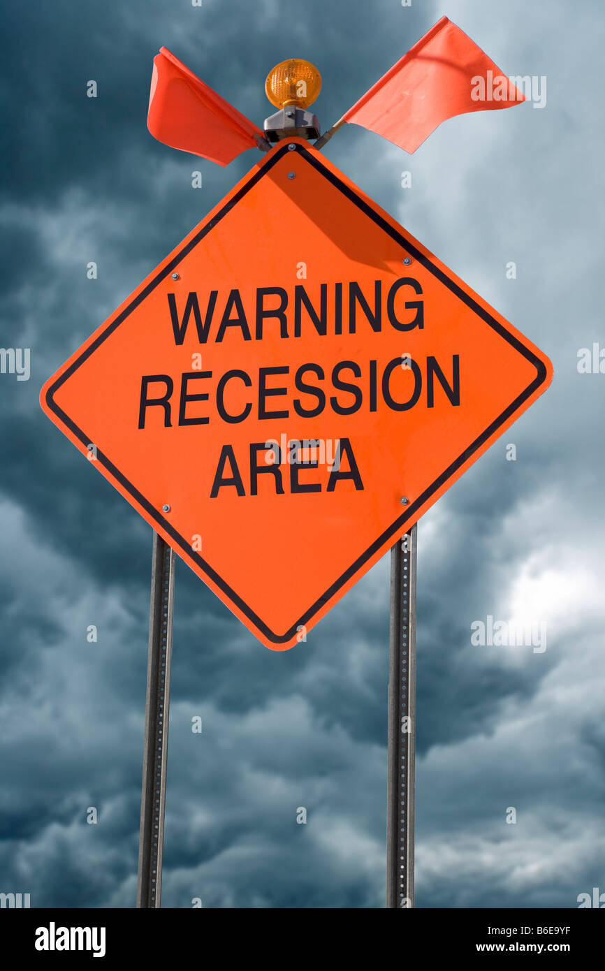 An orange highway safety sign with the words Warning Recession Area on it Stock Photo